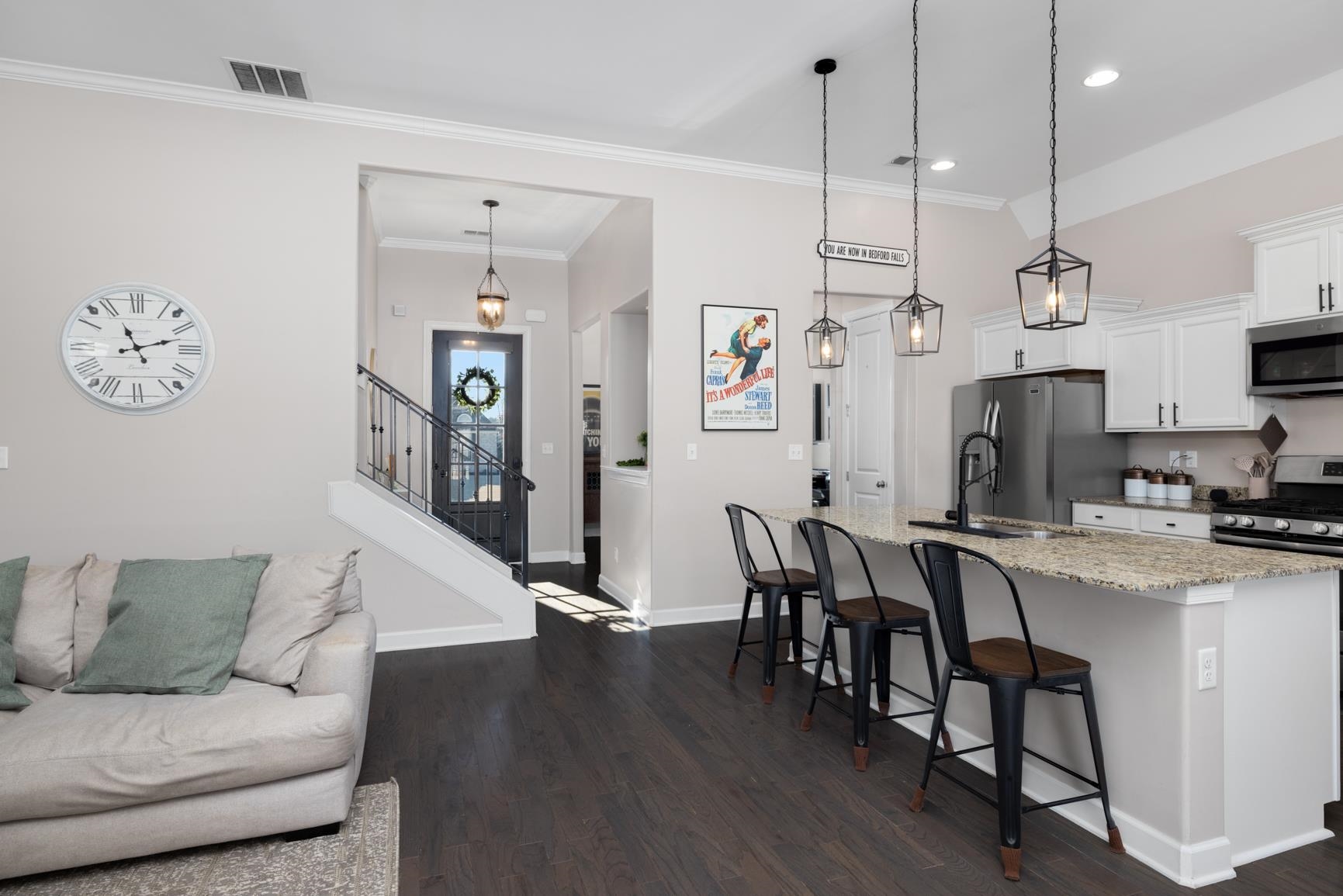 235 Misty Fields Road Oakland, TN 38060 - Photo 8 of 40 a living room with furniture kitchen view and a wooden floor