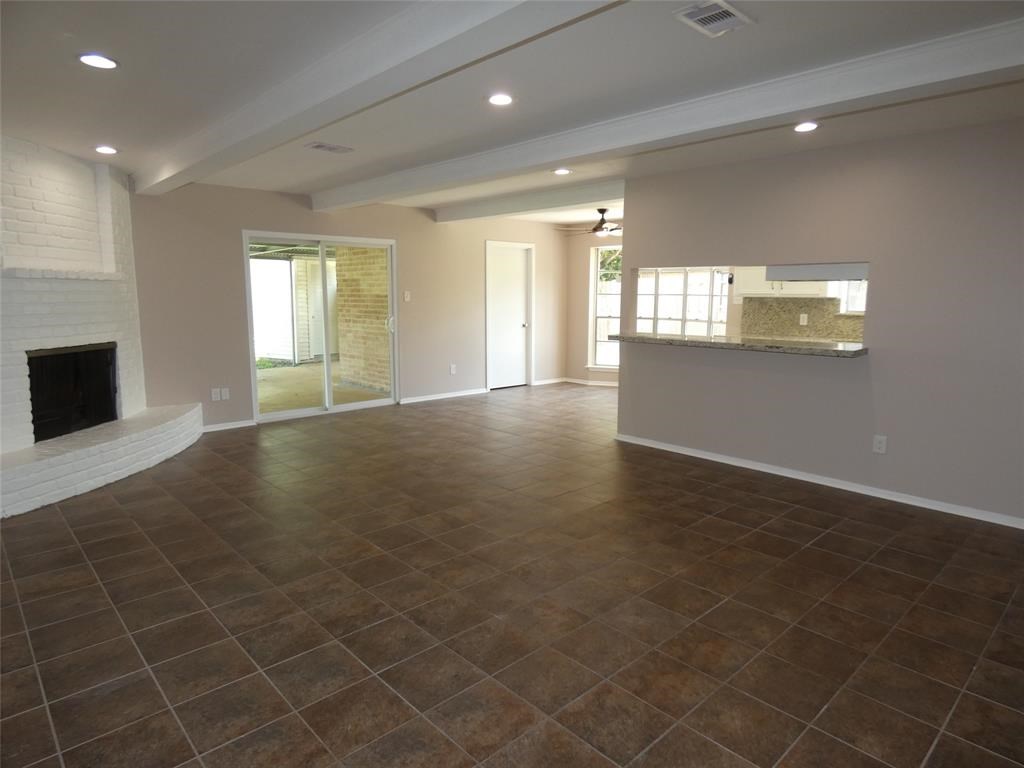 3406 Rockyridge Drive Houston, TX 77063 - Photo 4 of 13 a view of empty room with wooden floor and fan