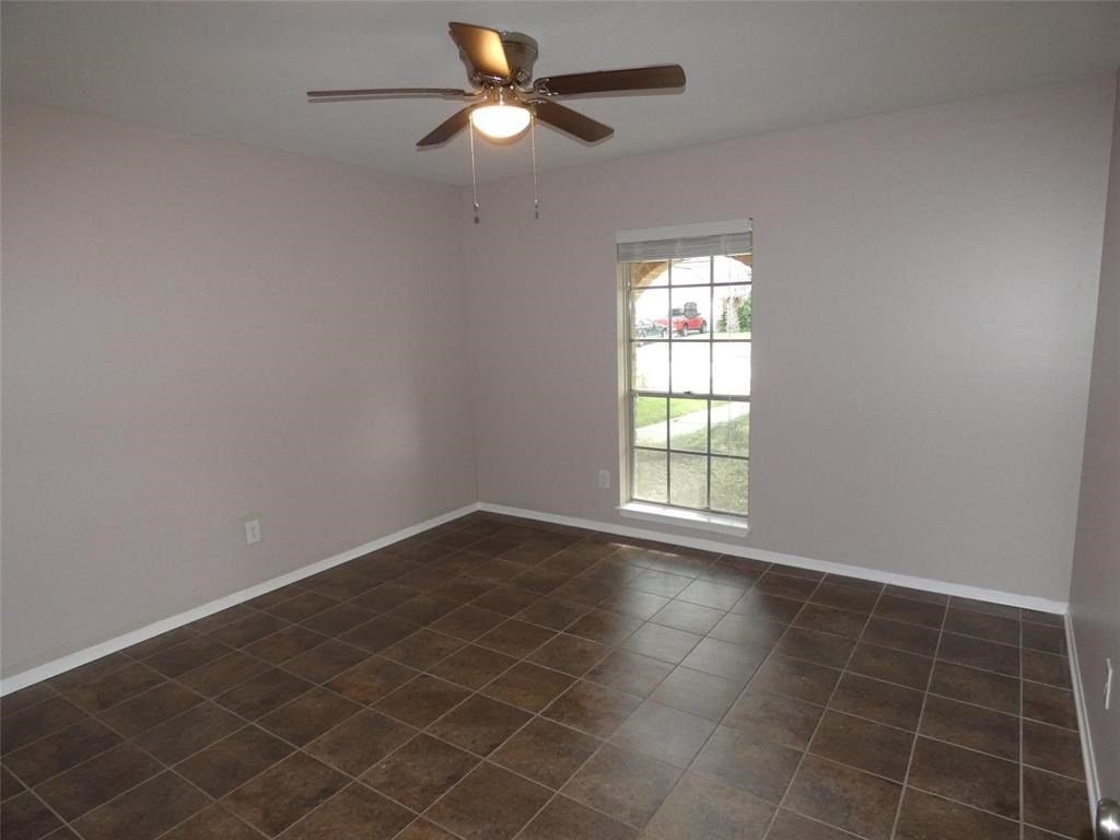 3406 Rockyridge Drive Houston, TX 77063 - Photo 7 of 13 en empty room with windows and fan