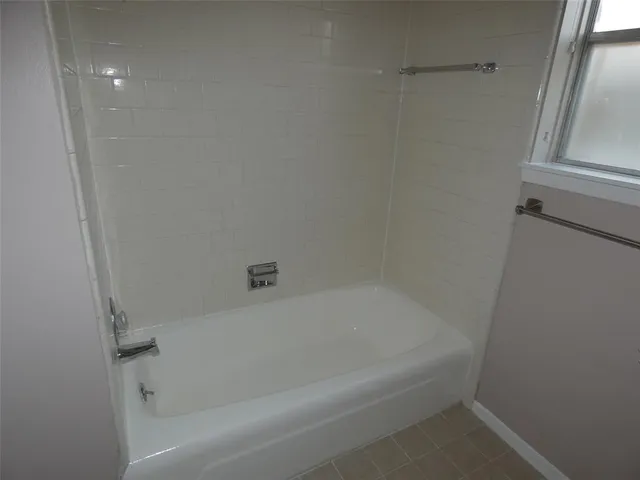 a close up of a bathtub in a bathroom