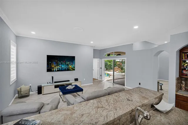 a kitchen with granite countertop wooden cabinets and stainless steel appliances