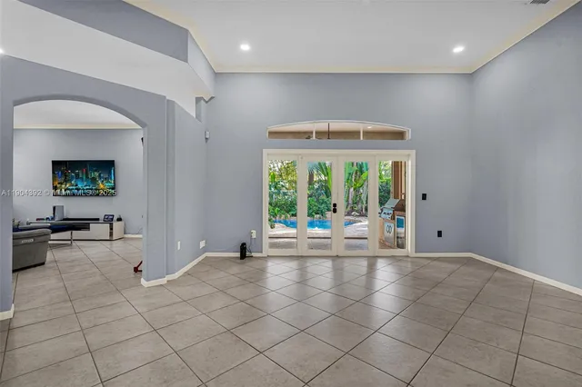 a kitchen with stainless steel appliances granite countertop a sink a stove and cabinets