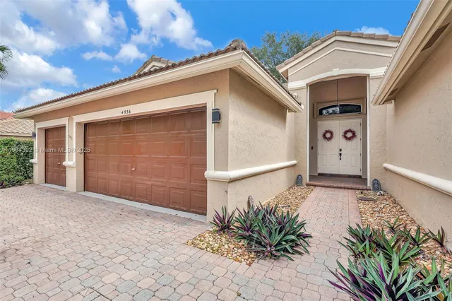 a front view of a house with a garage