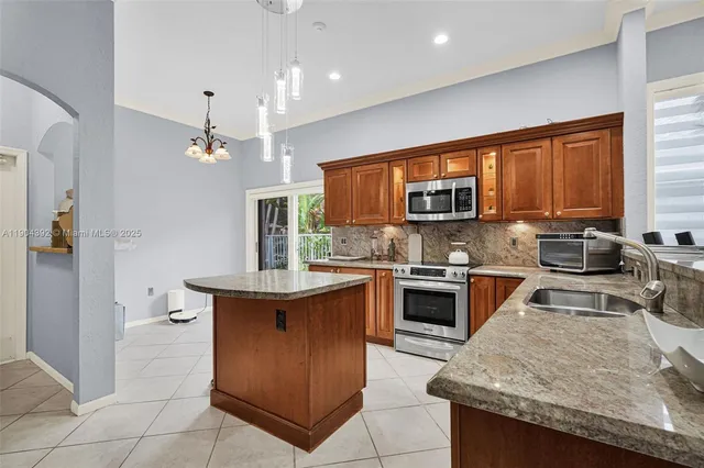 a bedroom with a bed and glass window