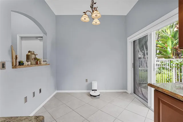 a spacious bathroom with a bathtub and shower