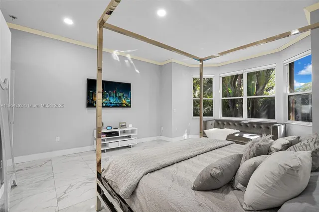 a view of a livingroom with workspace and a window