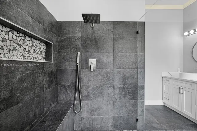 a kitchen with a stove and white cabinets