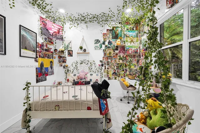 an aerial view of residential houses with outdoor space and ocean view