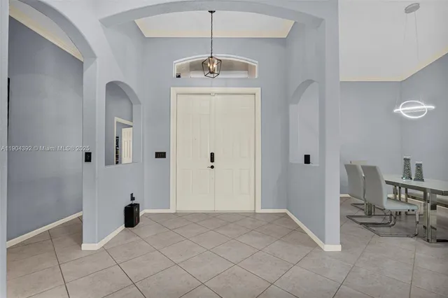 a view of a livingroom with a dinning table and staircase