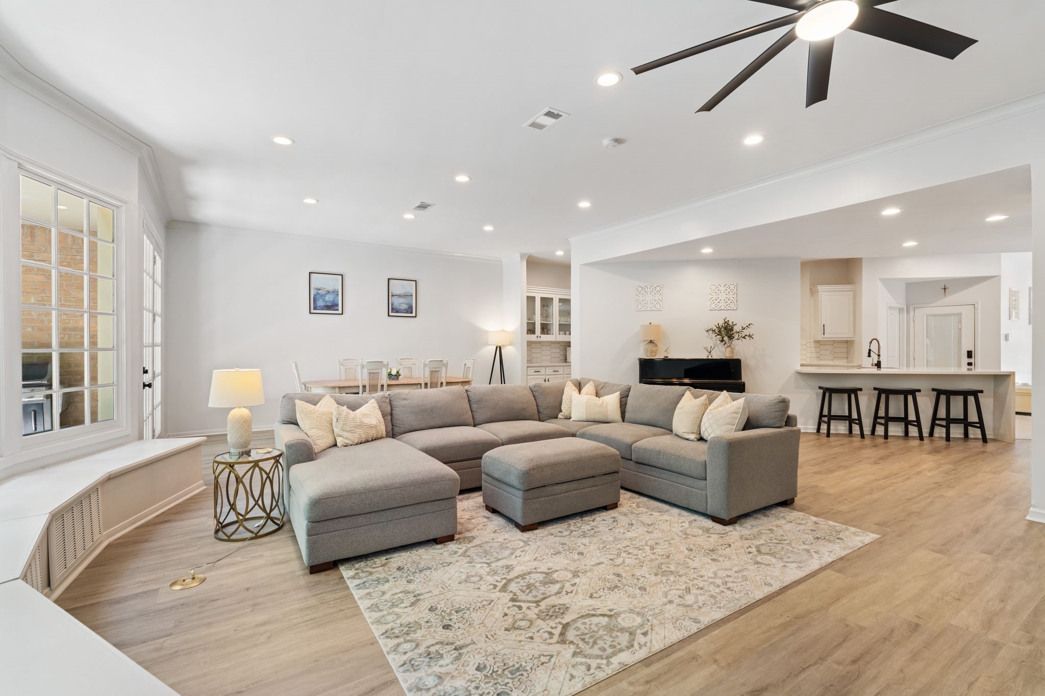 201 Vanderpool Lane, Unit 137 Houston, TX 77024 - Photo 42 of 42 This view highlights the open floor plan between the main living areas, with the kitchen, breakfast room, dining area, and family room all flowing together for an easy, connected layout.
