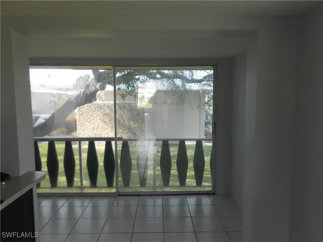 a view of a glass door and deck