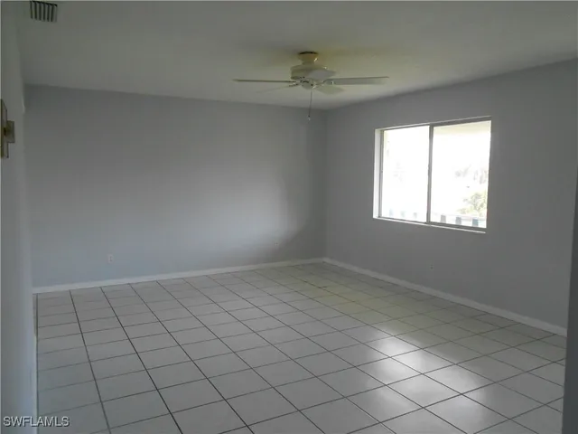 en empty room with windows