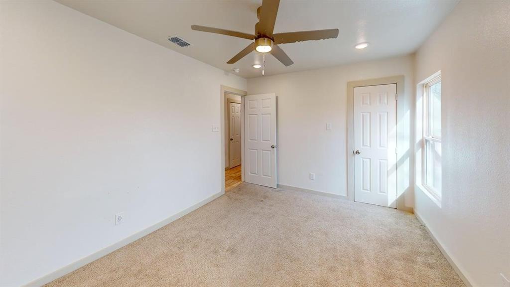 2554 Marfa Avenue Dallas, TX 75216 - Photo 13 of 19 Unfurnished bedroom featuring light carpet, a ceiling fan, recessed lighting, and a closet