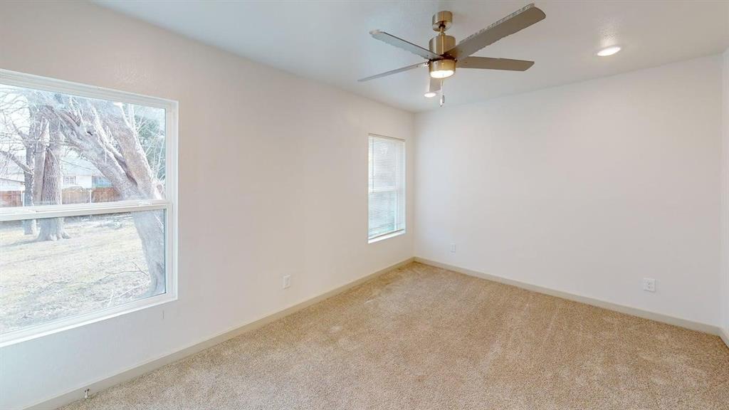 2554 Marfa Avenue Dallas, TX 75216 - Photo 14 of 19 Unfurnished room featuring carpet flooring, ceiling fan, and recessed lighting