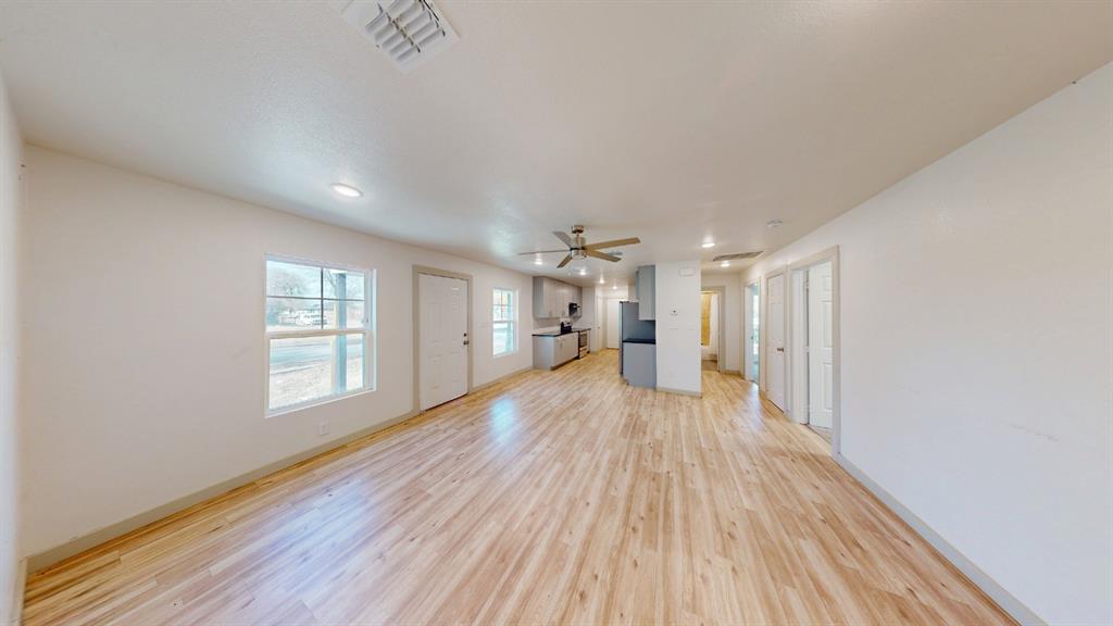 2554 Marfa Avenue Dallas, TX 75216 - Photo 9 of 19 Unfurnished living room featuring light wood-type flooring and recessed lighting