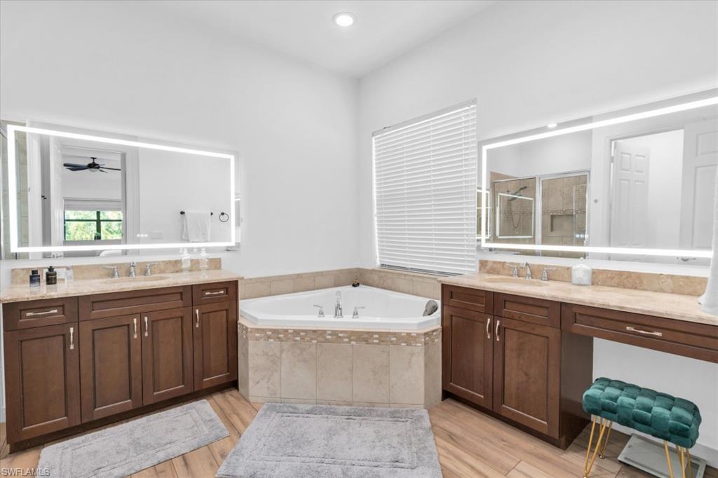 3376 Atlantic Circle Naples, FL 34119 - Photo 12 of 23 a bathroom with a sink and a bathtub