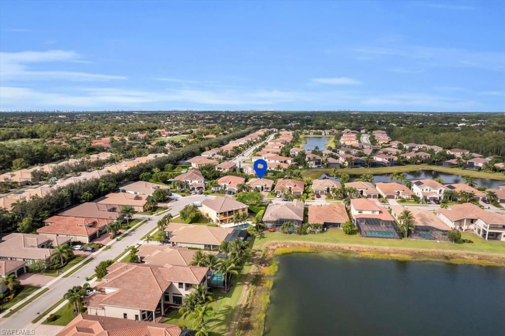 3376 Atlantic Circle Naples, FL 34119 - Photo 17 of 23 an aerial view of residential building and lake