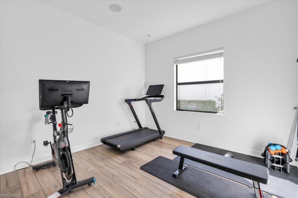 3376 Atlantic Circle Naples, FL 34119 - Photo 23 of 23 a view of a room with gym equipment