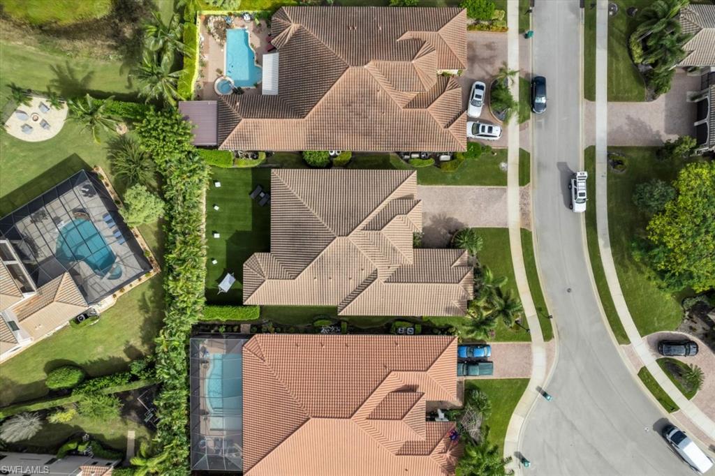 3376 Atlantic Circle Naples, FL 34119 - Photo 6 of 23 an aerial view of a house with swimming pool and garden