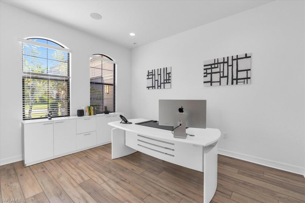 3376 Atlantic Circle Naples, FL 34119 - Photo 10 of 23 a view of a workspace with furniture and a window