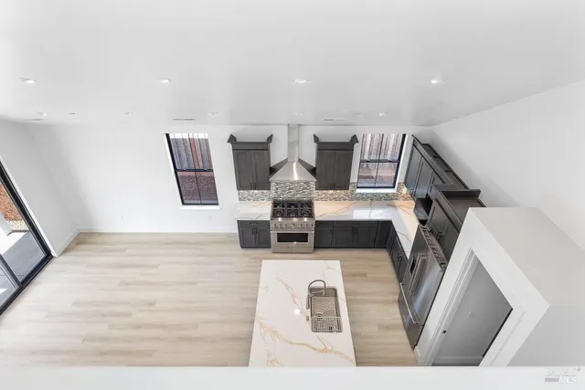 a view of kitchen with wooden cabinet