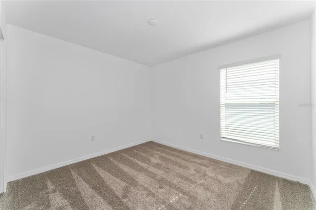 a bathroom with a bathtub shower sink vanity and toilet