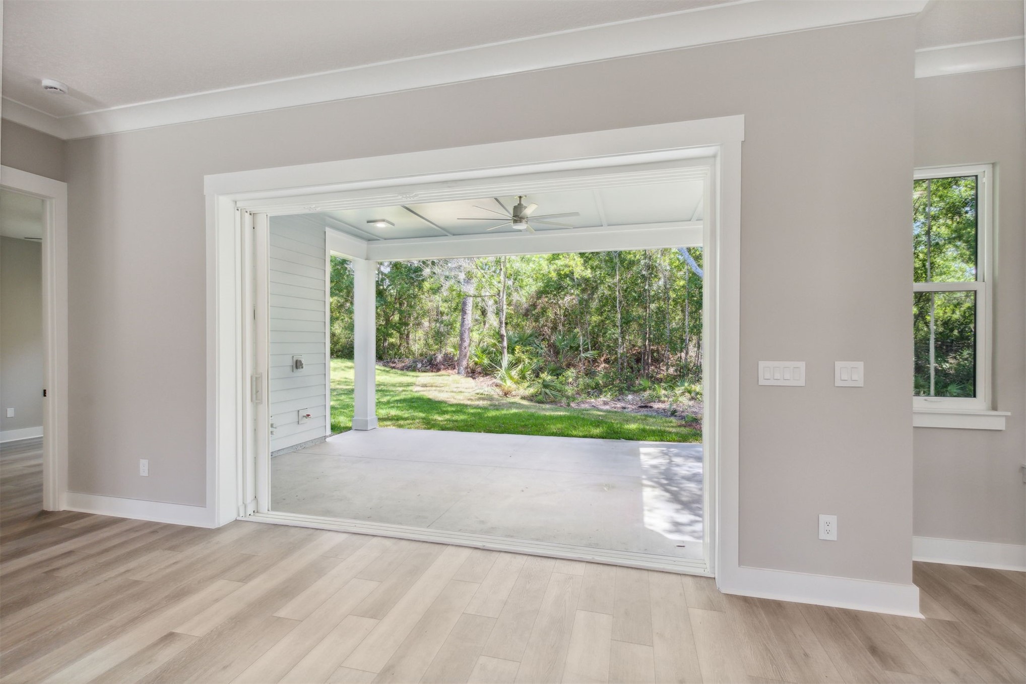 96050 Captains Pointe Road Yulee, FL 32097 - Photo 32 of 36 a view of an empty room with wooden floor and a window