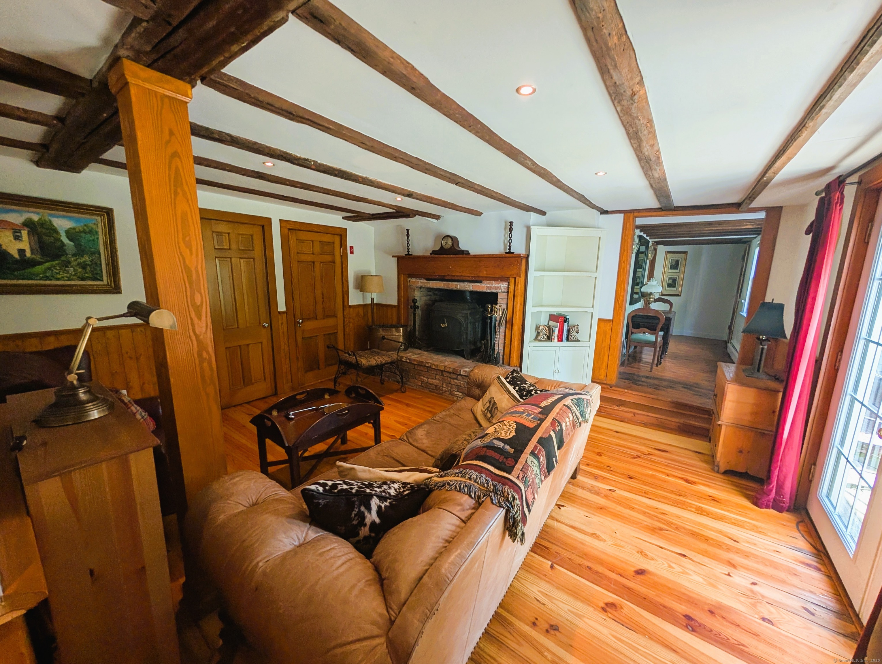 47 Hollow Tree Ridge Road Darien, CT 06820 - Photo 29 of 40 a living room with furniture and a fireplace
