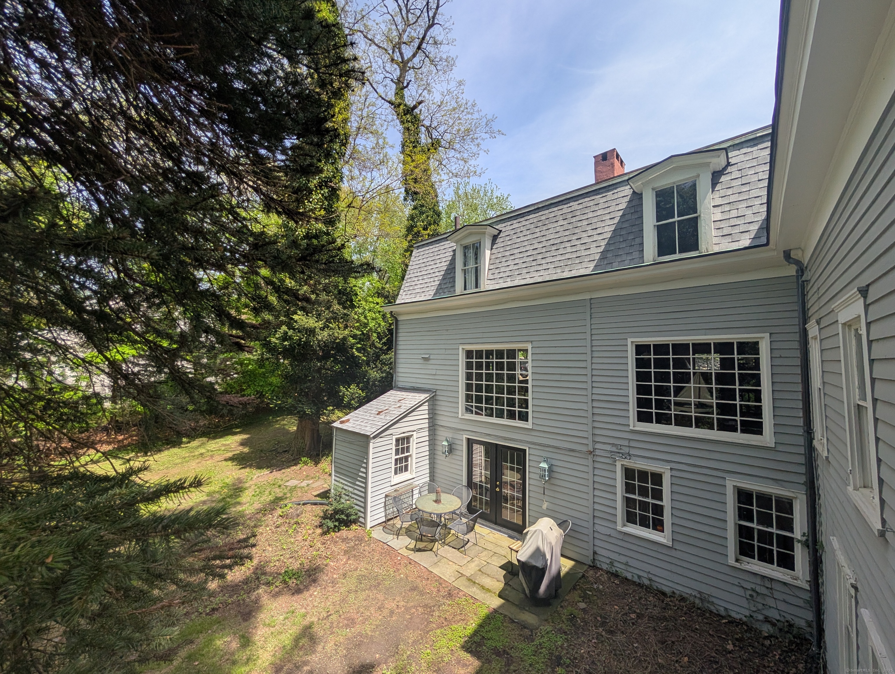 47 Hollow Tree Ridge Road Darien, CT 06820 - Photo 36 of 40 a house that has a tree in front of the house