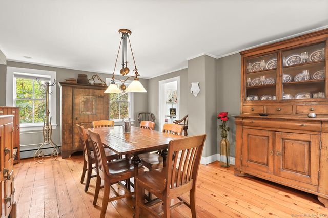 a view of a dining room with furniture window and outside view