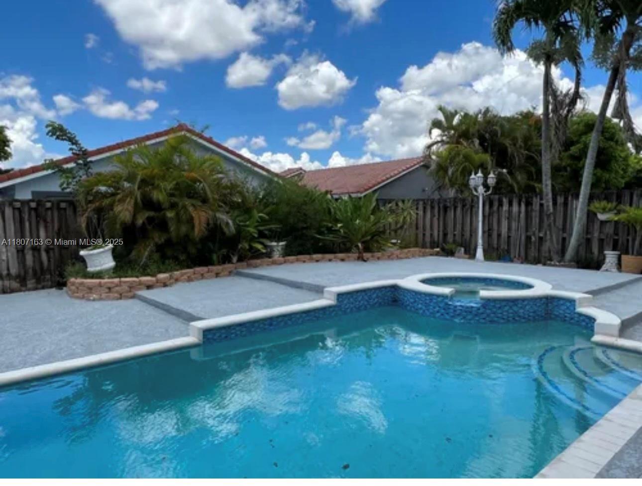 16461 Southwest 100th Terrace Miami, FL 33196 - Photo 13 of 18 a view of a backyard