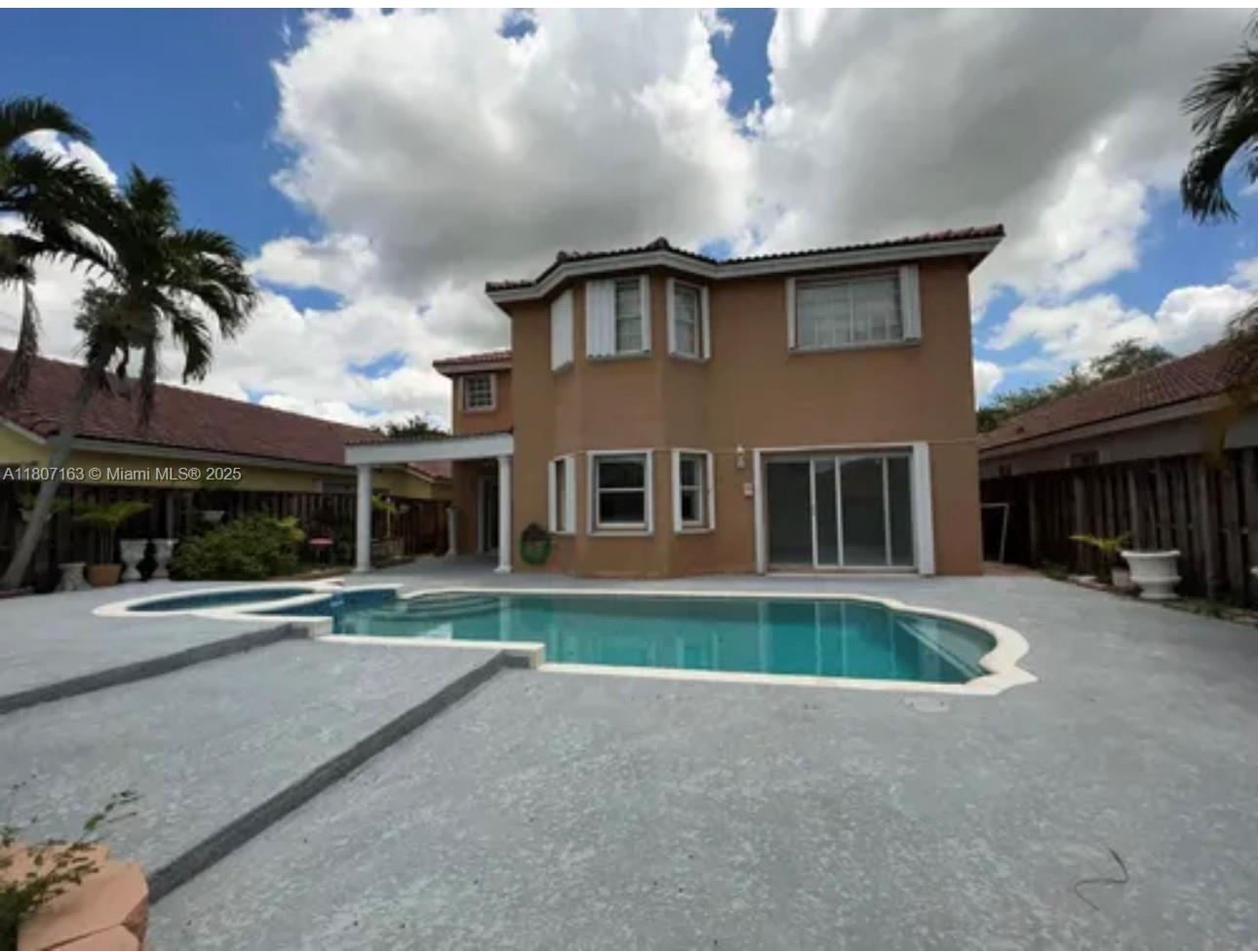 16461 Southwest 100th Terrace Miami, FL 33196 - Photo 14 of 18 front view of house with a yard