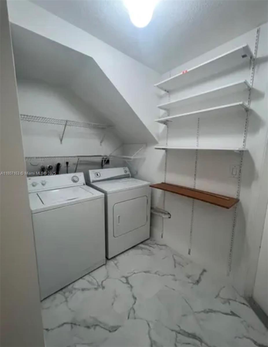 16461 Southwest 100th Terrace Miami, FL 33196 - Photo 17 of 18 a utility room with dryer and washer