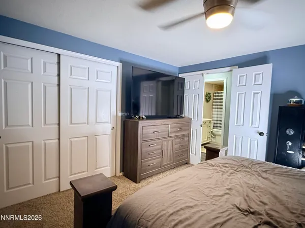 a bedroom with a bed and a dresser