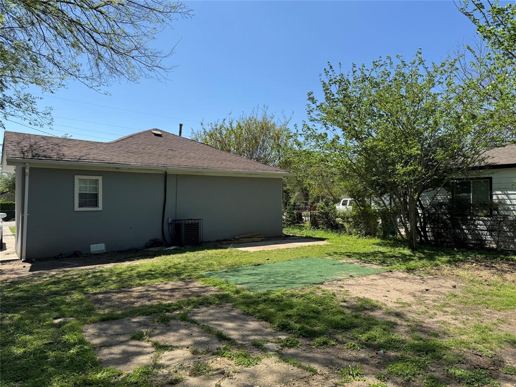 7315 Toland Street Dallas, TX 75227 - Photo 15 of 16 a house that has a tree in front of it