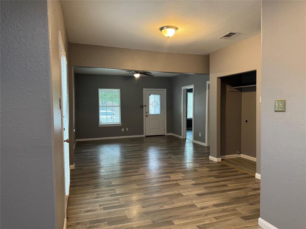 7315 Toland Street Dallas, TX 75227 - Photo 8 of 16 a view of empty room with wooden floor
