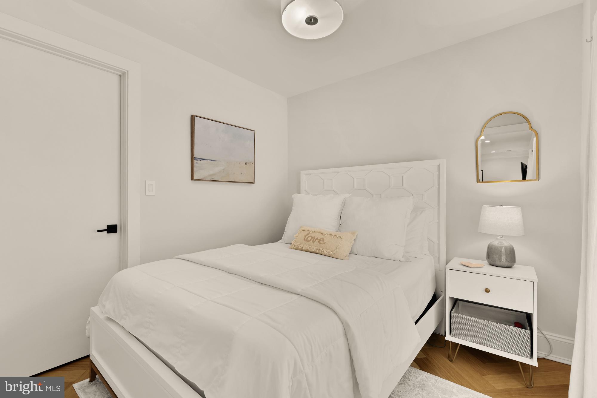 2630 39th Street Northwest, Unit 1 Washington, DC 20007 - Photo 15 of 26 a bedroom with a bed and a window