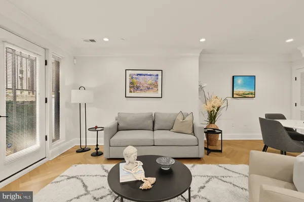 a living room with furniture and a rug