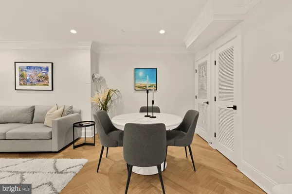 a living room with furniture a desk and chair