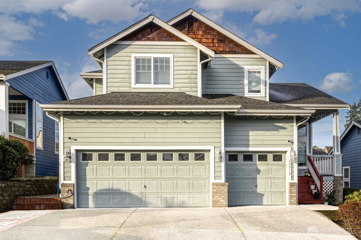 a front view of a house with a garage