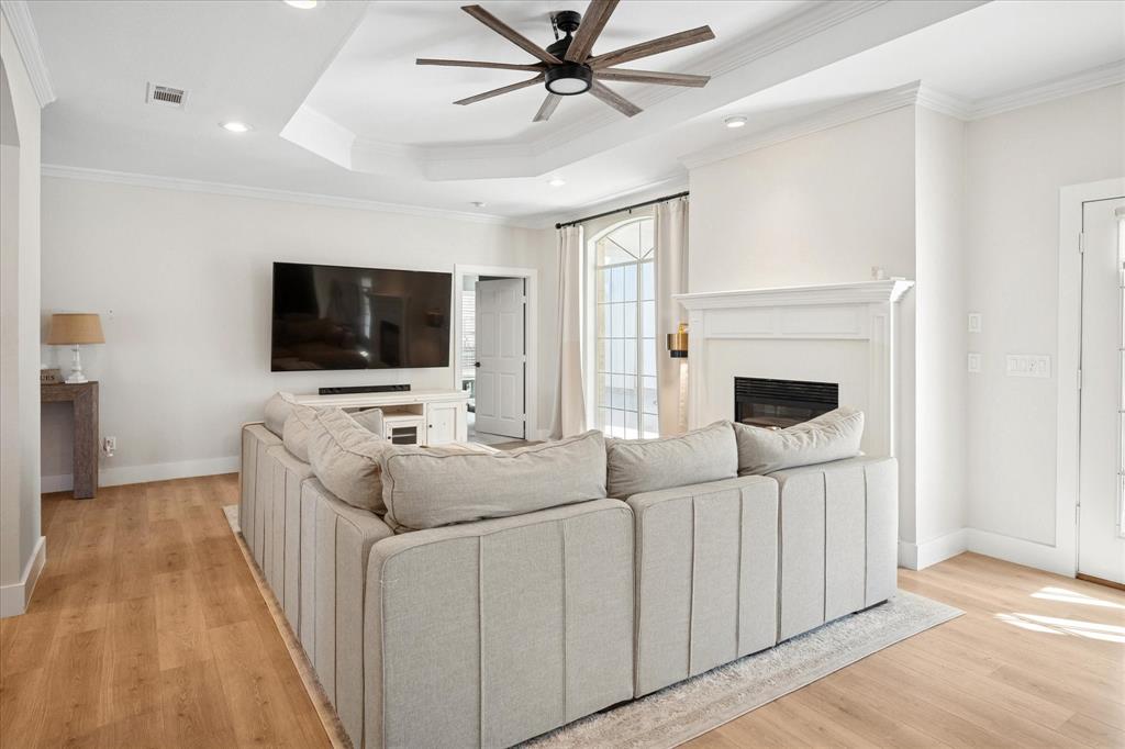 437 South 1st Street Krum, TX 76249 - Photo 11 of 38 a living room with furniture and a flat screen tv