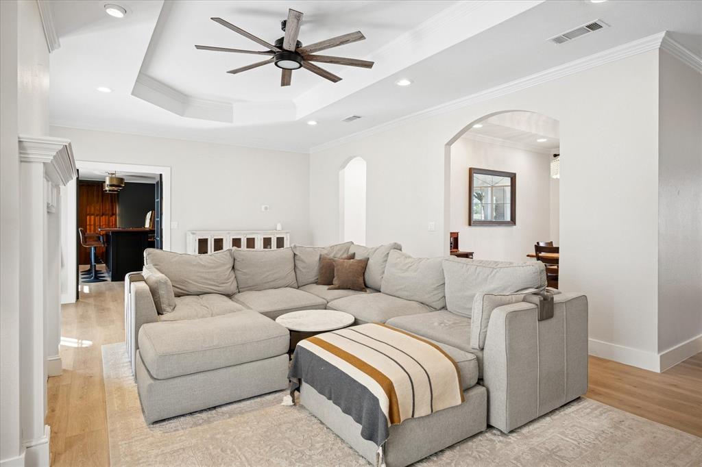 437 South 1st Street Krum, TX 76249 - Photo 13 of 38 a living room with furniture and a ceiling fan