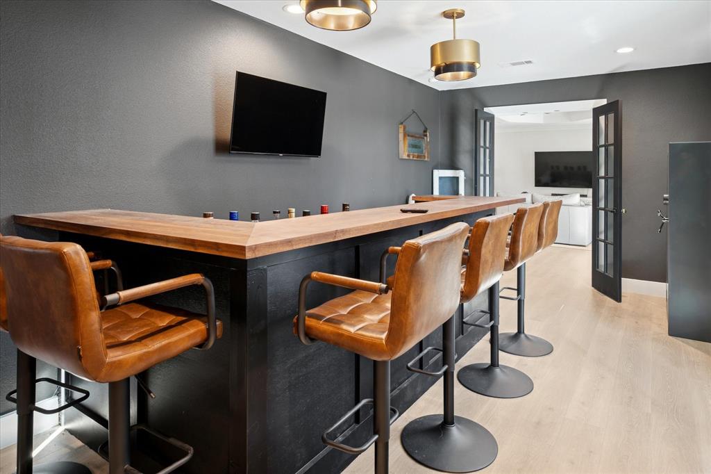 437 South 1st Street Krum, TX 76249 - Photo 15 of 38 a room with furniture and a flat screen tv