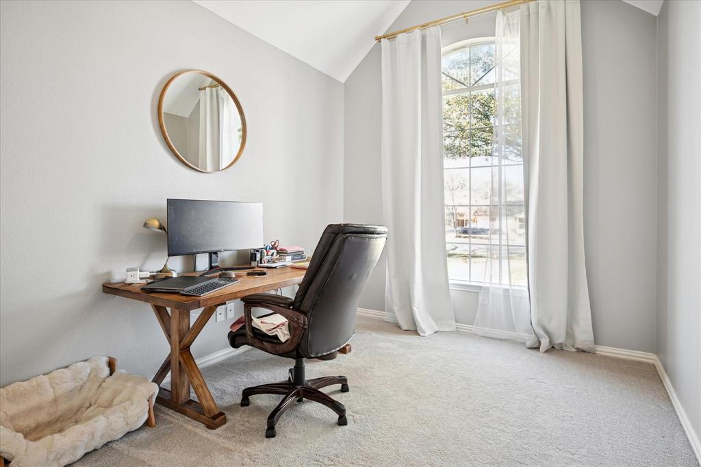 437 South 1st Street Krum, TX 76249 - Photo 24 of 38 a view of a workspace with furniture and a window