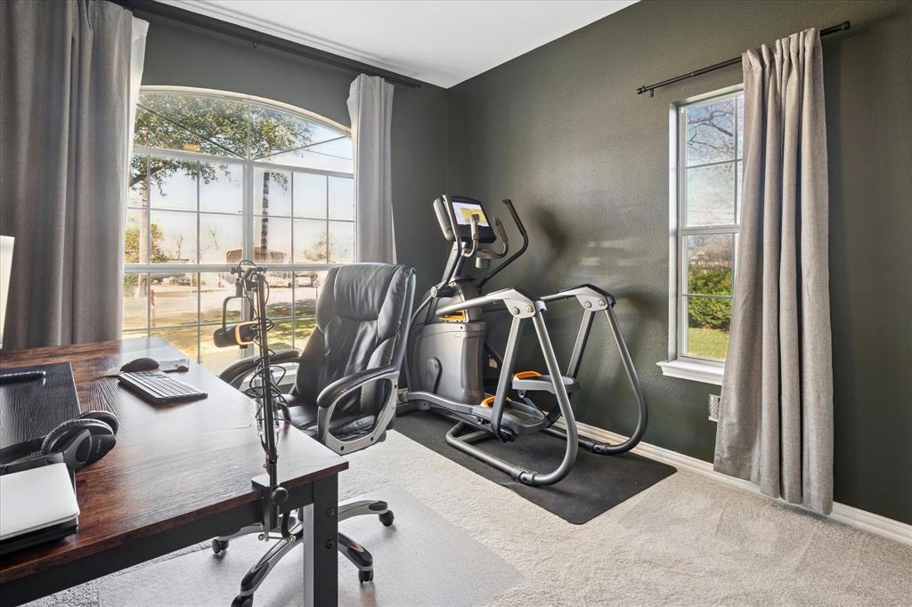 437 South 1st Street Krum, TX 76249 - Photo 25 of 38 a view of a room with gym equipment
