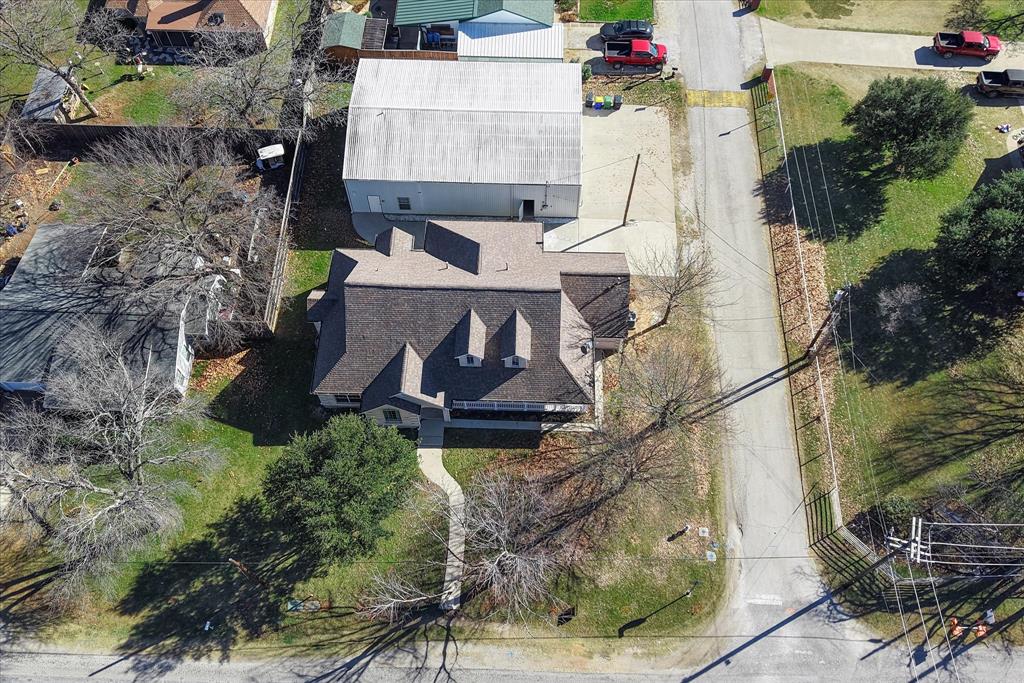 437 South 1st Street Krum, TX 76249 - Photo 35 of 38 an aerial view of residential houses with outdoor space