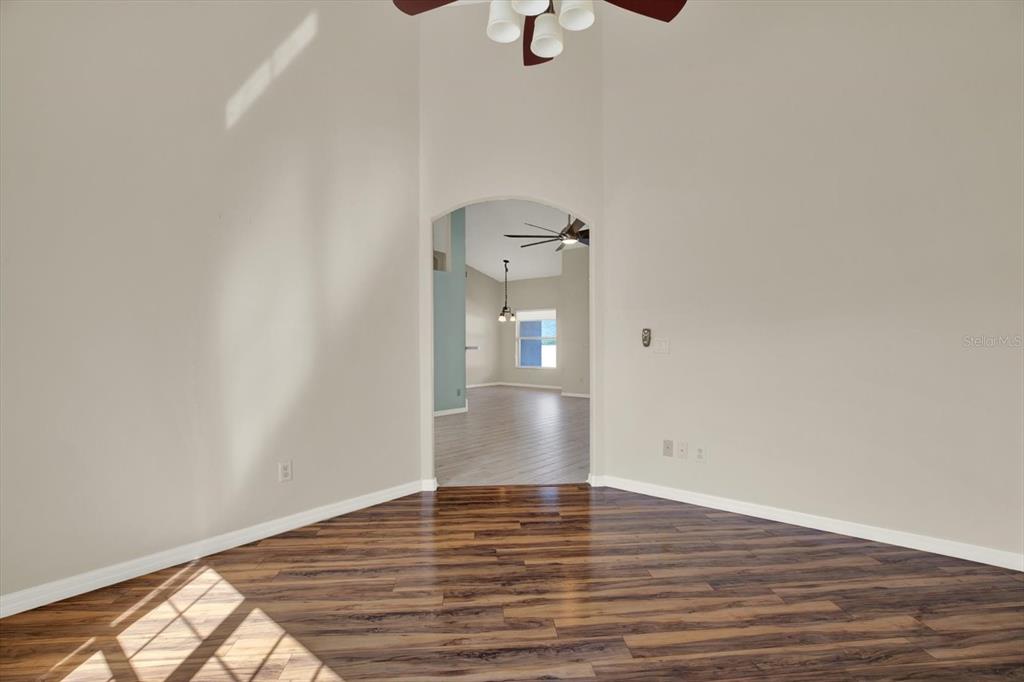 4400 Dior Road Spring Hill, FL 34609 - Photo 6 of 37 a view of empty room with wooden floor