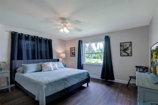 a bedroom with a bed and furniture