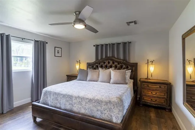 a kitchen with a granite countertop sink stove and cabinets