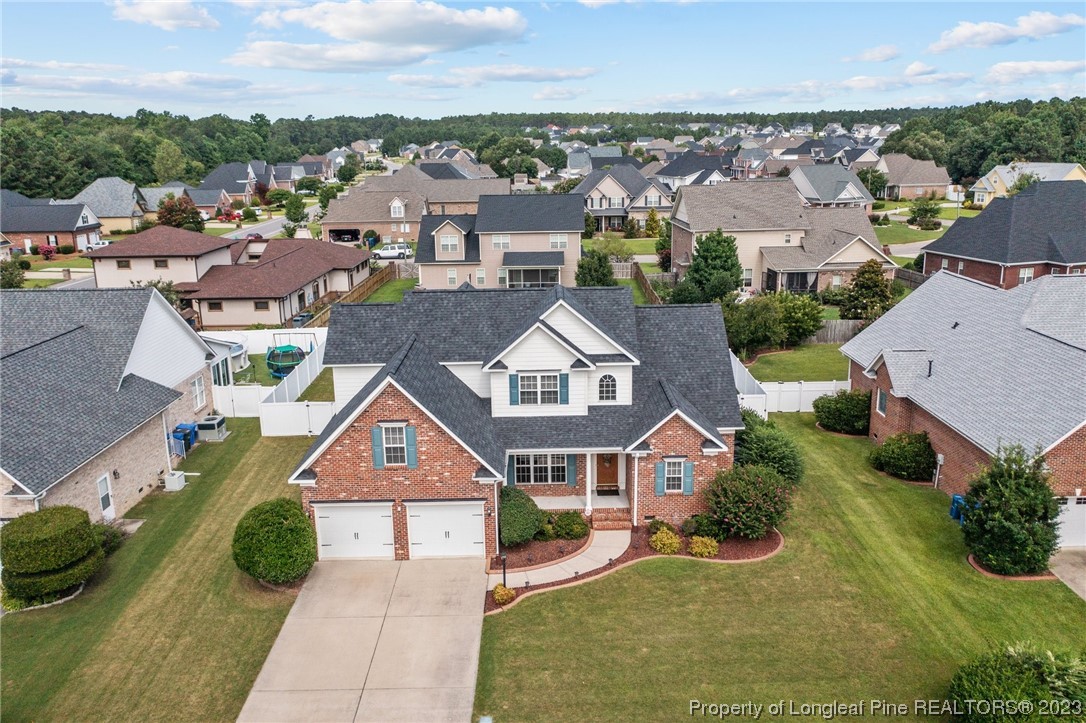 6407 Cattesmore Road Fayetteville, NC 28311 - Photo 2 of 42 an aerial view of multiple houses with a yard